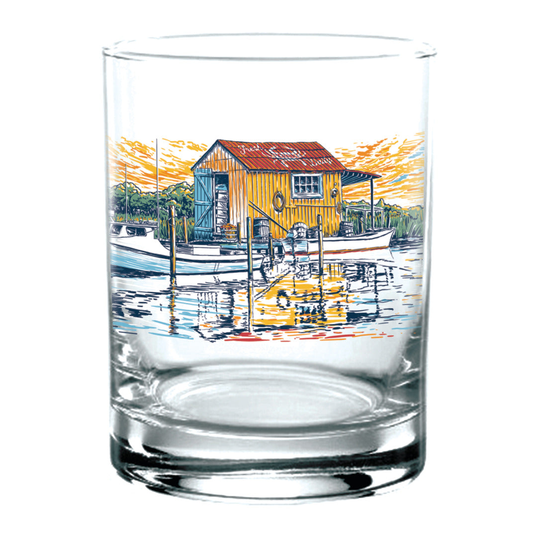 Clear glass with a colorful illustration of a boat and cabin on a white background