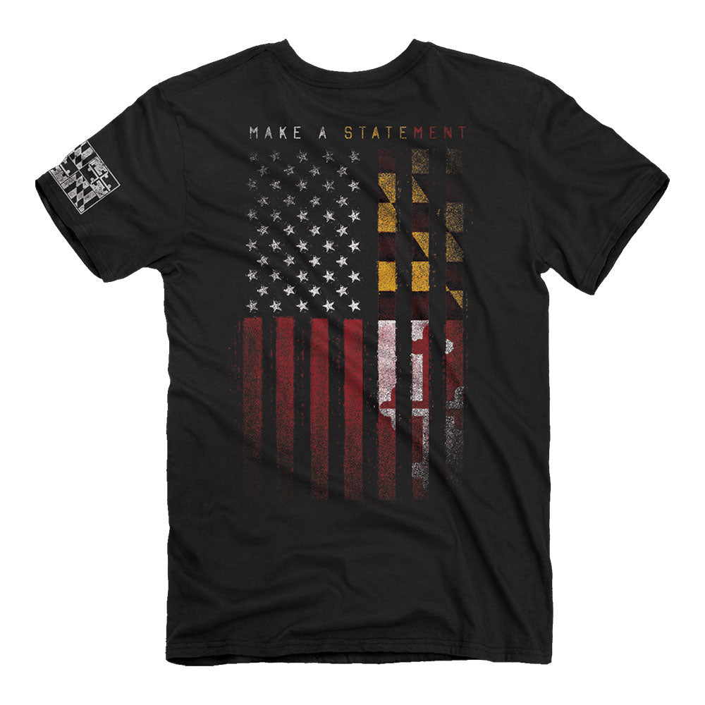 Black t-shirt with a graphic print of the American flag and geometric shapes, along with the text 'MAKE A STATEMENT' on the front.