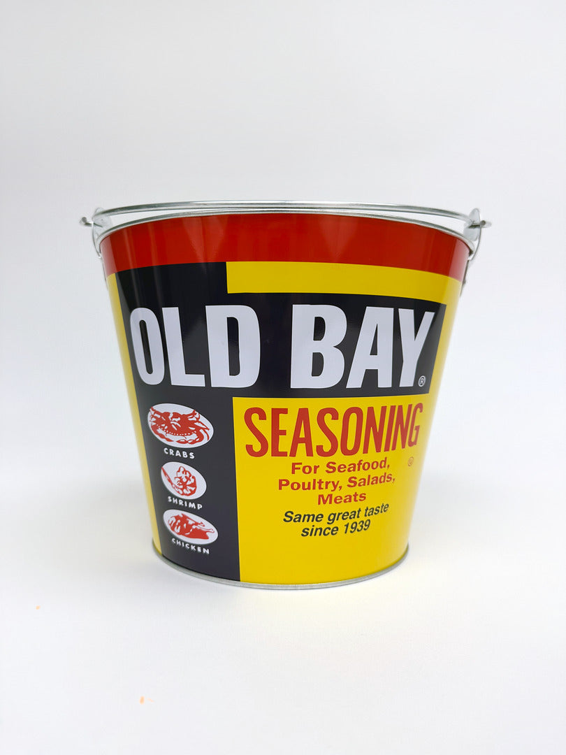 Old Bay seasoning metal bucket on a white background