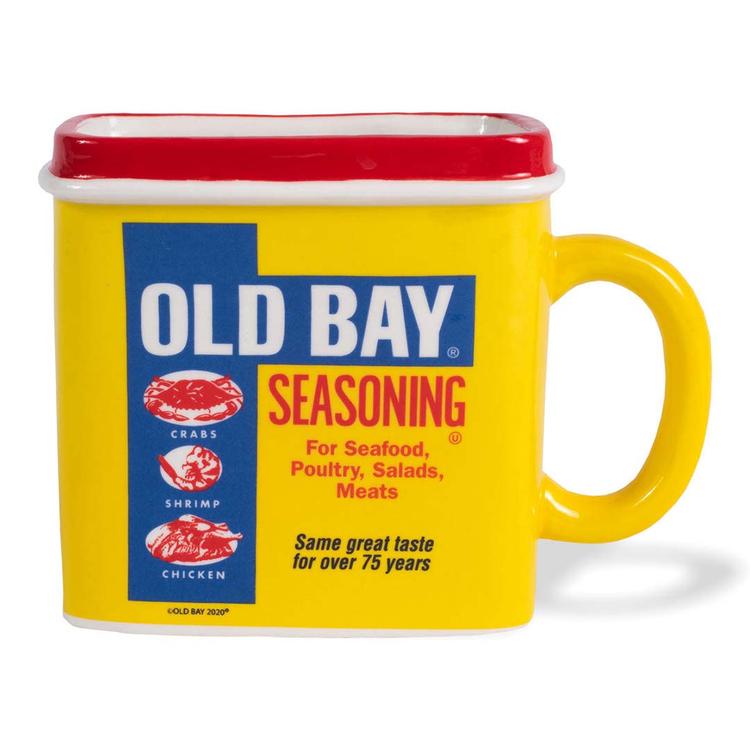A yellow mug with the 'OLD BAY SEASONING' branding and text that reads 'Same great taste for over 75 years'. The mug has a yellow handle and is designed in a can shape.